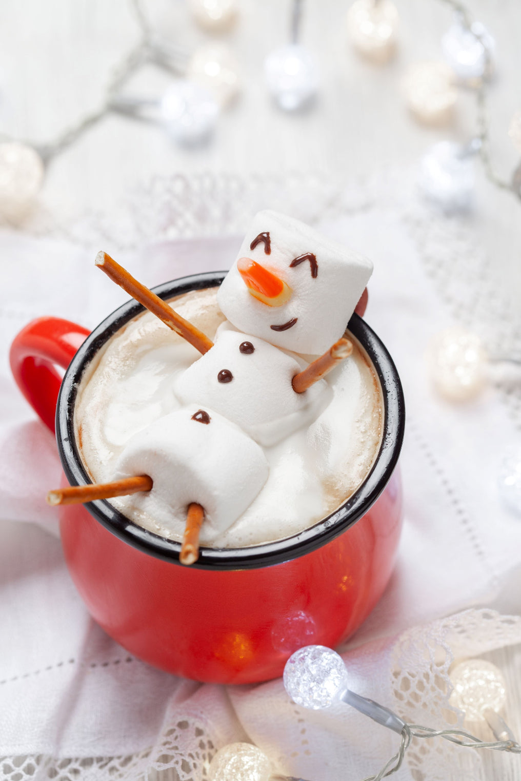 A marshmallow snowman over a cup of Tropical Bear Santa's Favorite Blend Specialty Coffee. Fresh coffee delivered to you.