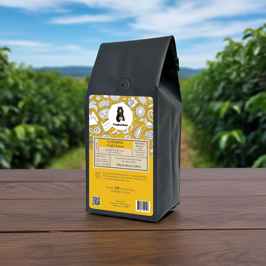 A bag of Colombia Single Origin Specialty Coffee on a table in the middle of a farm