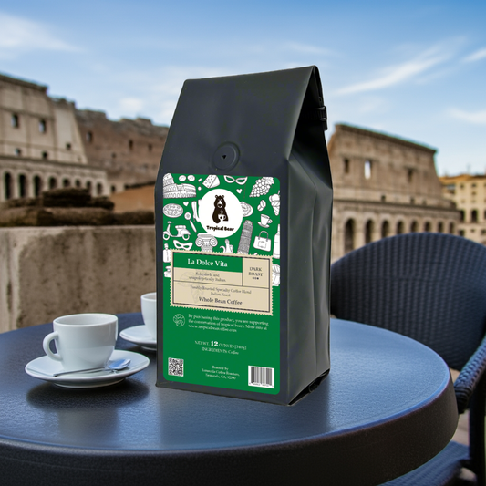 A bag of La Dolce Vita Specialty Coffee Blend placed on a table next to the Colosseum in Rome.