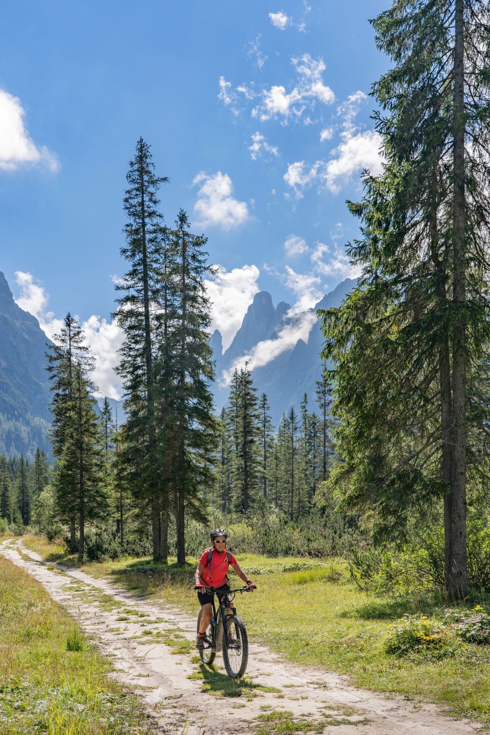 Biker on a gravel road in the mountains