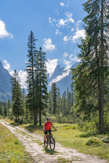 Biker on a gravel road in the mountains