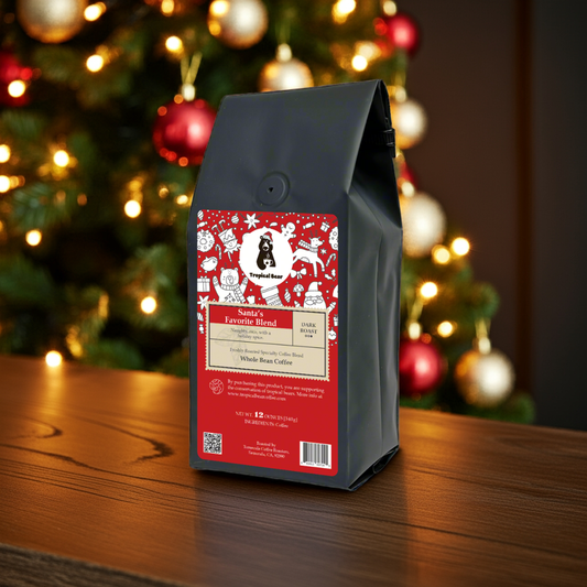 A bag of Santa's Favorite Blend Specialty Coffee placed on a table in front of a Christmas tree.