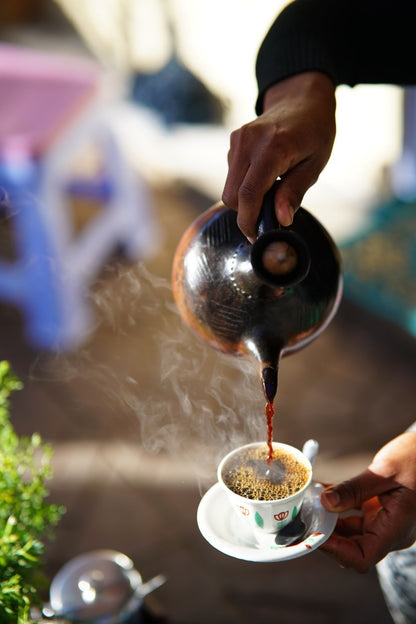 Ethiopia Specialty Coffee Tastiest Coffee Pouring in the mug Ethiopian Style Freshly Roasted to your Door